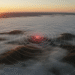 firefly gemini flash hyper realistic aerial view of gilroy and surrounding hills at sunrise, dramatic fog 797237