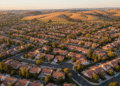 firefly gemini flash aerial view of gilroy suburban streets at golden hour, soft sunlight, warm natural co 841714