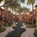 firefly gemini flash create a cinematic street level rendering of a spanish revival townhome community in 671001
