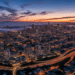 firefly gemini flash ultra realistic aerial dusk view of the bay area skyline with glowing city lights, hi 110805